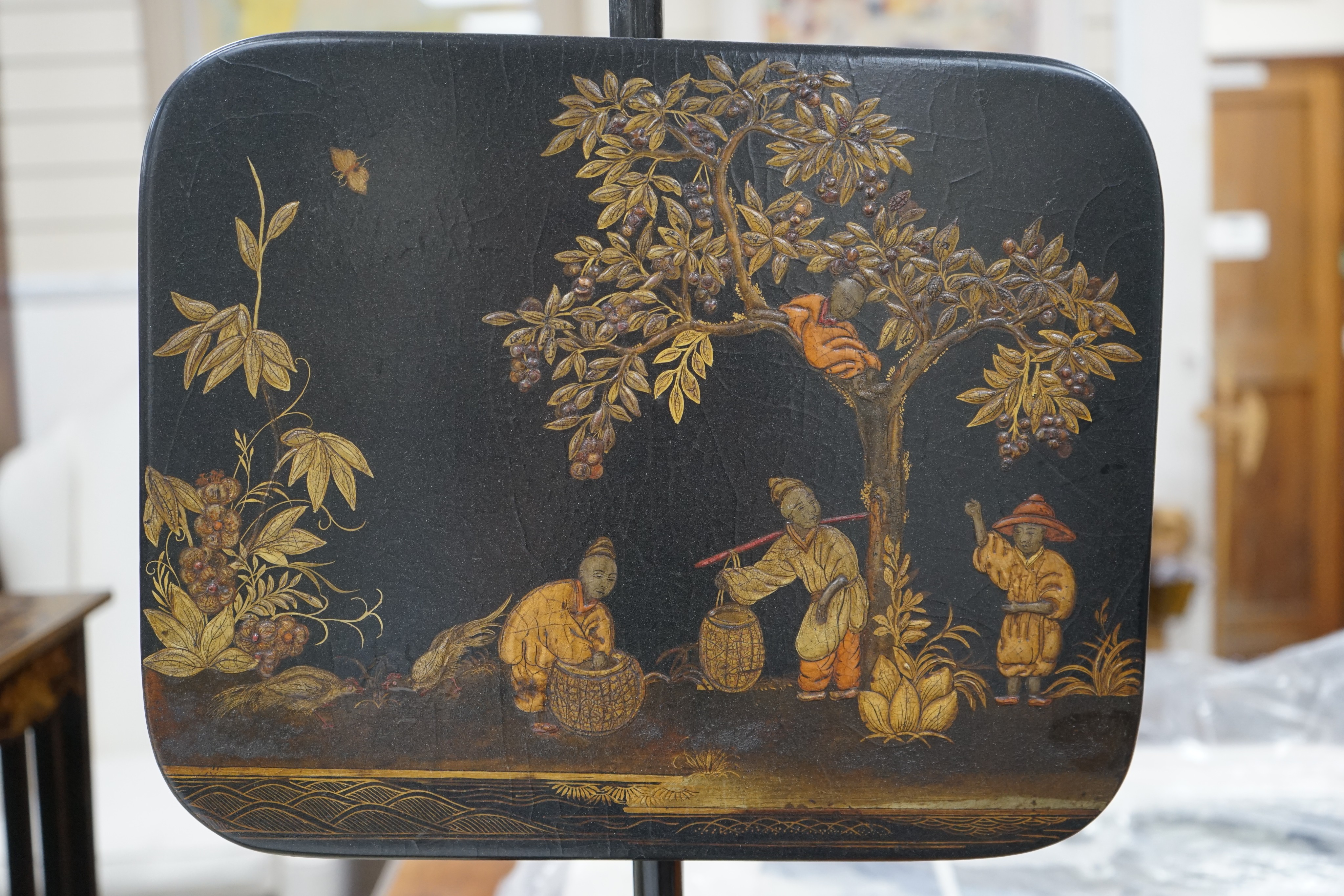 A pair of 19th century chinoiserie lacquer pole screens, height 152cm